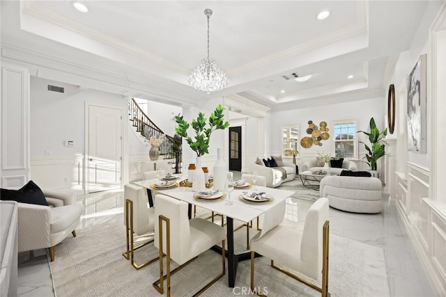 4840 Temple City Blvd, Temple City, CA 91780 - dining room featuring a decorative wall, a raised ceiling, light marble finish flooring, a chandelier, and stairs