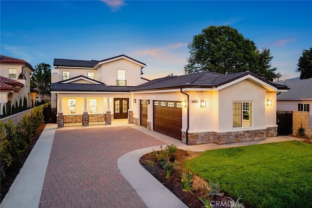 4840 Temple City Blvd, Temple City, CA 91780 - view of front of house with stone siding, a garage, french doors, and stucco siding
