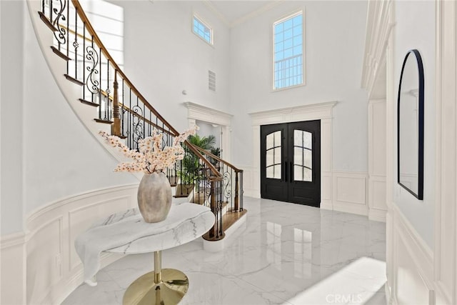 4840 Temple City Blvd, Temple City, CA 91780 - entrance foyer with a decorative wall, marble tiled flooring, stairs, a wainscoted wall, and french doors
