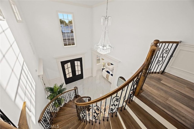4840 Temple City Blvd, Temple City, CA 91780 - foyer with a chandelier, wood finished floors, a wainscoted wall, a decorative wall, and a high ceiling