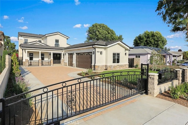 4840 Temple City Blvd, Temple City, CA 91780 - view of front of house with stone siding, stucco siding, a garage, and driveway