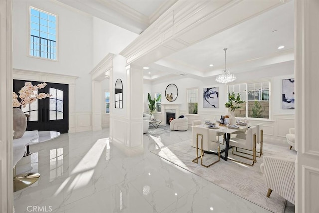 4840 Temple City Blvd, Temple City, CA 91780 - entrance foyer featuring a decorative wall, marble tiled floors, a fireplace, wainscoting, and a chandelier