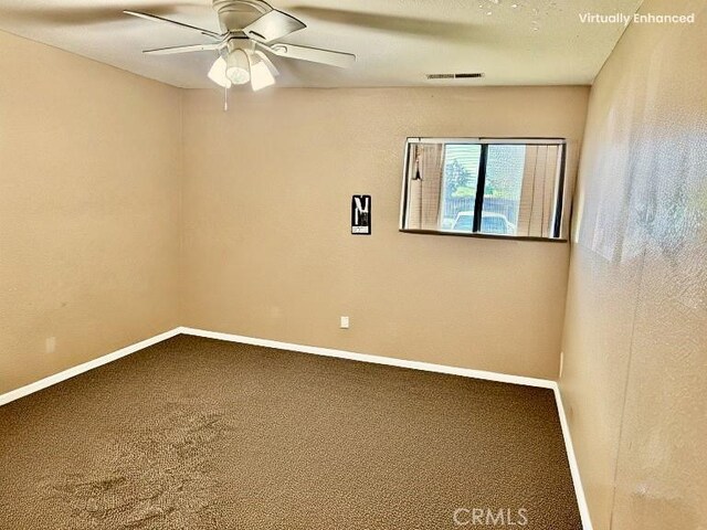 631 N St, Corning, CA 96021 - carpeted empty room with baseboards and a ceiling fan