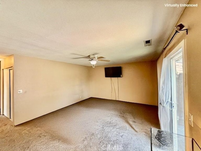 631 N St, Corning, CA 96021 - spare room with carpet, a ceiling fan, and a textured ceiling