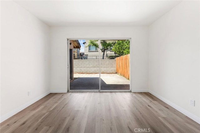 1822 Appleton Way, Pomona, CA 91767 - empty room with wood finished floors and baseboards