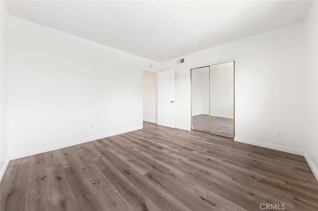 1822 Appleton Way, Pomona, CA 91767 - unfurnished bedroom featuring wood finished floors, a closet, and baseboards