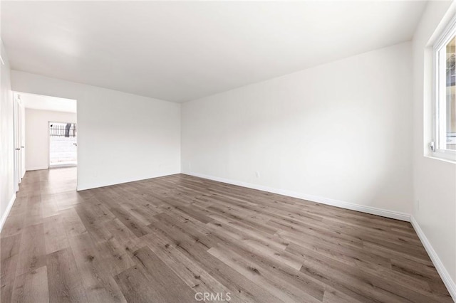 1822 Appleton Way, Pomona, CA 91767 - empty room featuring wood finished floors and baseboards