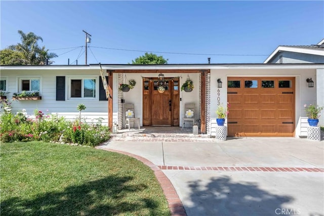 6903 E Driscoll St, Long Beach, CA 90815 - ranch-style home with an attached garage, a front yard, and concrete driveway