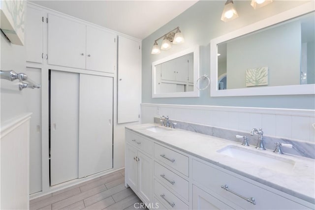 6903 E Driscoll St, Long Beach, CA 90815 - full bath with double vanity and wood finished floors