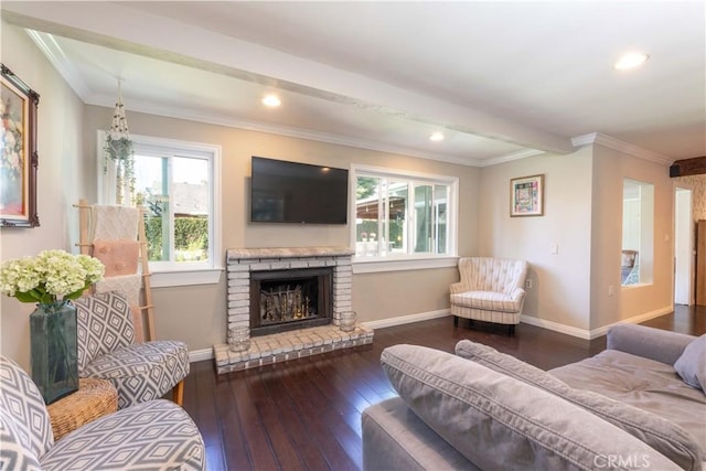 6903 E Driscoll St, Long Beach, CA 90815 - living room featuring a brick fireplace, baseboards, hardwood / wood-style floors, ornamental molding, and recessed lighting