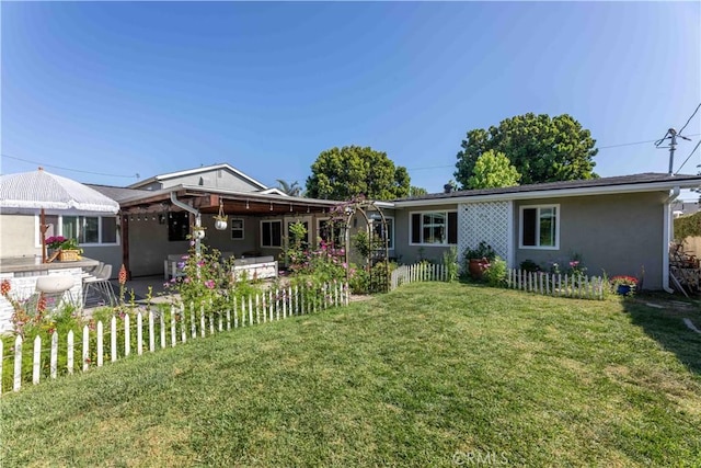 6903 E Driscoll St, Long Beach, CA 90815 - view of front facade featuring a front lawn, stucco siding, and a patio area