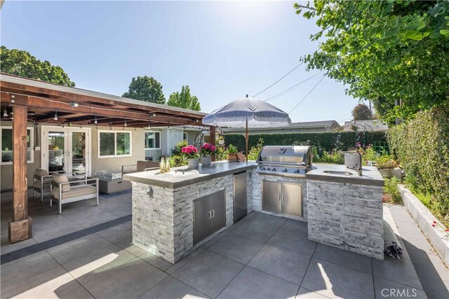 6903 E Driscoll St, Long Beach, CA 90815 - view of patio / terrace with french doors and a sink