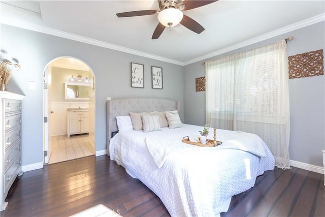 6903 E Driscoll St, Long Beach, CA 90815 - bedroom featuring dark wood-type flooring, crown molding, baseboards, connected bathroom, and ceiling fan