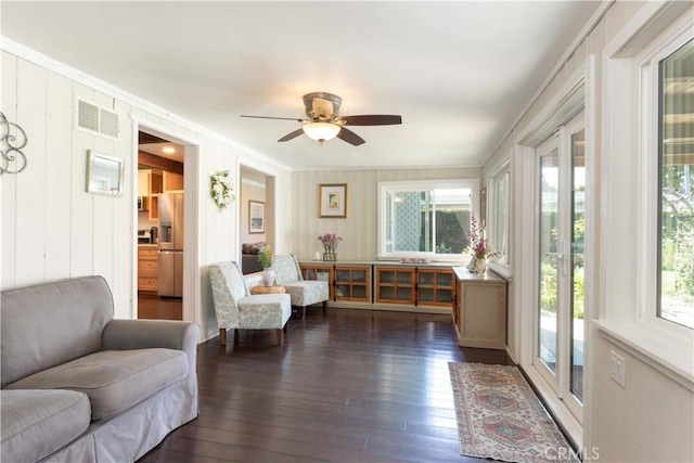 6903 E Driscoll St, Long Beach, CA 90815 - living room with plenty of natural light, hardwood / wood-style flooring, ornamental molding, and a ceiling fan