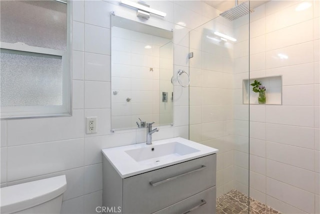 6903 E Driscoll St, Long Beach, CA 90815 - full bathroom featuring a walk in shower, vanity, toilet, and tile walls
