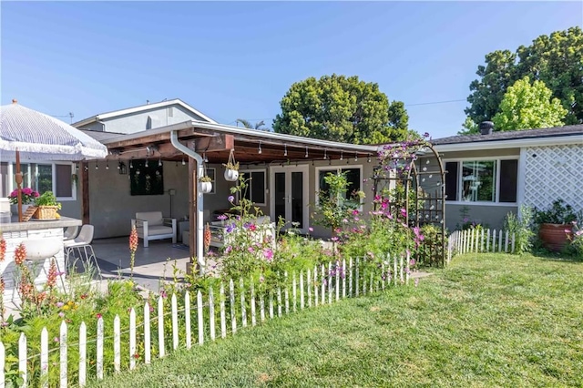 6903 E Driscoll St, Long Beach, CA 90815 - rear view of property with a patio area, a lawn, and stucco siding