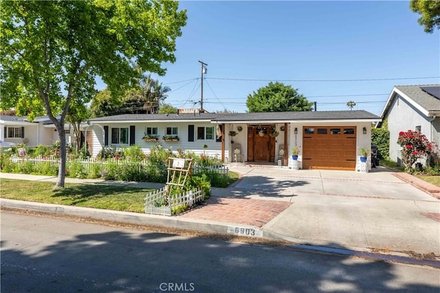 6903 E Driscoll St, Long Beach, CA 90815 - ranch-style home featuring concrete driveway and an attached garage