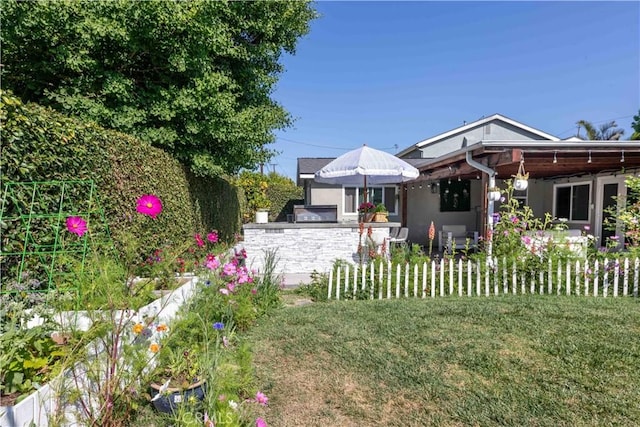 6903 E Driscoll St, Long Beach, CA 90815 - view of green lawn with an outdoor kitchen and a patio area