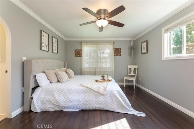6903 E Driscoll St, Long Beach, CA 90815 - bedroom with dark wood finished floors, ornamental molding, baseboards, arched walkways, and ceiling fan