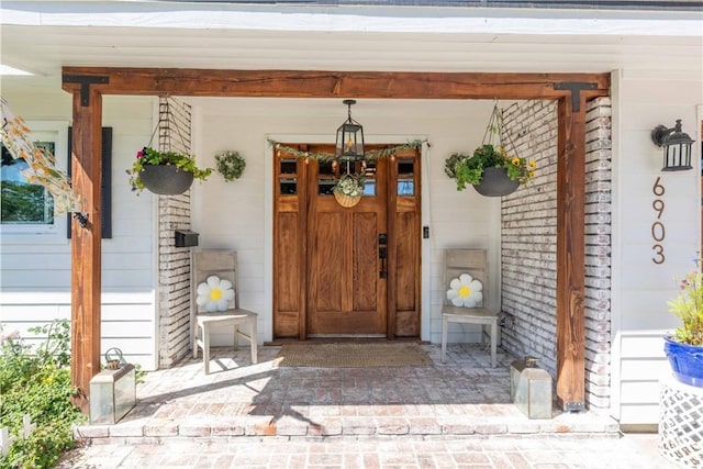 6903 E Driscoll St, Long Beach, CA 90815 - view of exterior entry featuring a porch