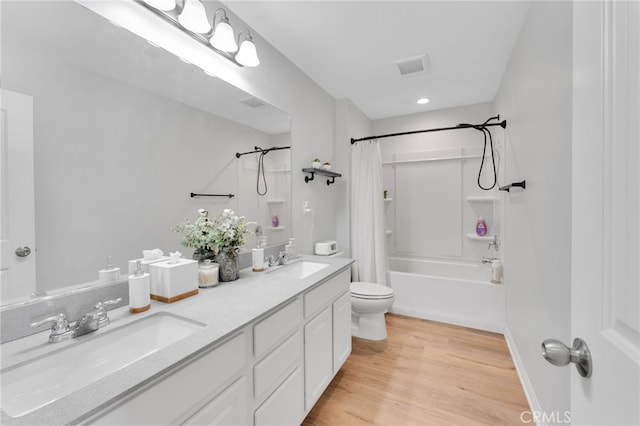 4777 Magnum Way, Jurupa Valley, CA 91752 - full bathroom with toilet, shower / tub combo with curtain, wood finished floors, double vanity, and recessed lighting