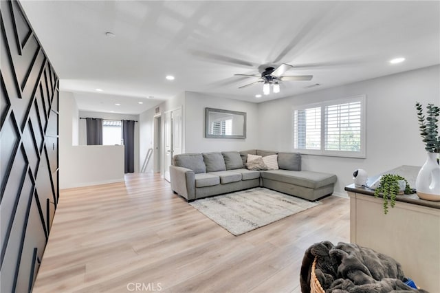 4777 Magnum Way, Jurupa Valley, CA 91752 - living area featuring light wood-type flooring, recessed lighting, a ceiling fan, and baseboards