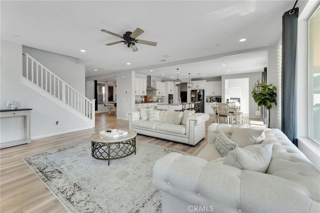 4777 Magnum Way, Jurupa Valley, CA 91752 - living room featuring stairway, light wood finished floors, a ceiling fan, recessed lighting, and baseboards