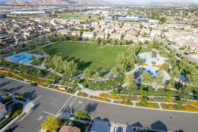 4777 Magnum Way, Jurupa Valley, CA 91752 - aerial view of property and surrounding area featuring a mountainous background and nearby suburban area