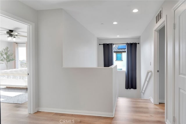 4777 Magnum Way, Jurupa Valley, CA 91752 - corridor featuring an upstairs landing, light wood-type flooring, recessed lighting, and baseboards