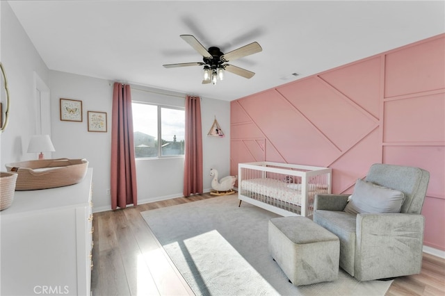 4777 Magnum Way, Jurupa Valley, CA 91752 - bedroom featuring light wood-style flooring, ceiling fan, and baseboards