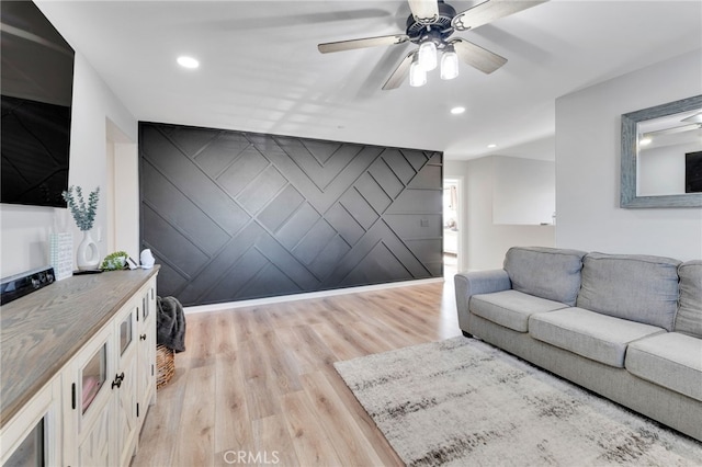 4777 Magnum Way, Jurupa Valley, CA 91752 - living room with light wood finished floors, ceiling fan, recessed lighting, and an accent wall