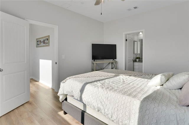 4777 Magnum Way, Jurupa Valley, CA 91752 - bedroom featuring light wood-type flooring, ceiling fan, and ensuite bath