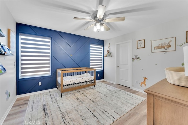 4777 Magnum Way, Jurupa Valley, CA 91752 - bedroom with light wood-style flooring, baseboards, and a ceiling fan
