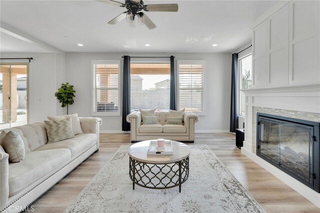 4777 Magnum Way, Jurupa Valley, CA 91752 - living area featuring ceiling fan, recessed lighting, baseboards, a tiled fireplace, and light wood-style flooring