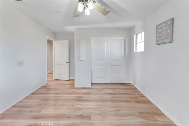 4777 Magnum Way, Jurupa Valley, CA 91752 - unfurnished bedroom featuring a closet, baseboards, light wood finished floors, and a ceiling fan