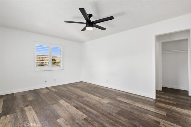 1741 Tustin Ave Unit 2A, Costa Mesa, CA 92627 - unfurnished bedroom featuring dark wood-type flooring, ceiling fan, and a closet