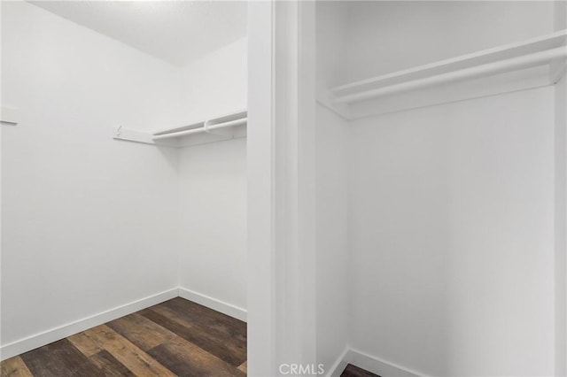 1741 Tustin Ave Unit 2A, Costa Mesa, CA 92627 - spacious closet featuring dark wood-style flooring