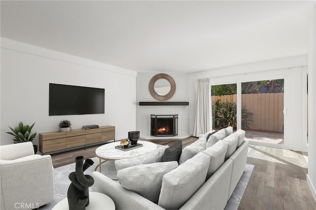1741 Tustin Ave Unit 2A, Costa Mesa, CA 92627 - living area featuring wood finished floors and a fireplace