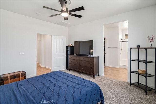 3615 Santa Monica Ct, Rosamond, CA 93560 - bedroom featuring light colored carpet, a ceiling fan, and connected bathroom