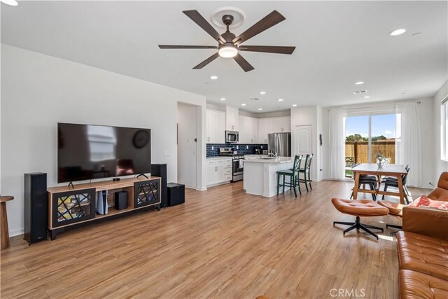 3615 Santa Monica Ct, Rosamond, CA 93560 - living room featuring ceiling fan, light wood-style flooring, and recessed lighting