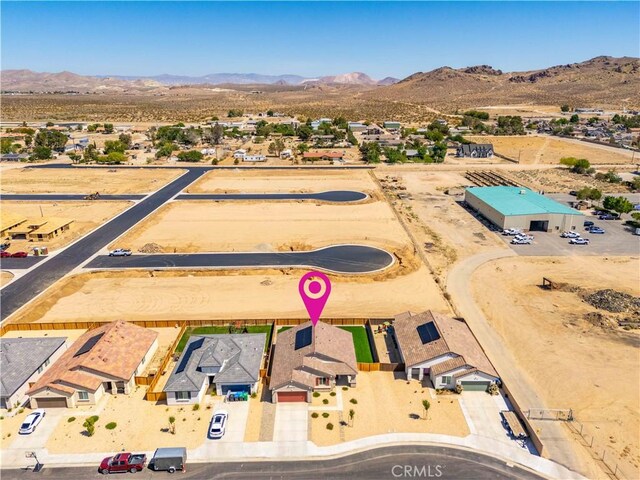 3615 Santa Monica Ct, Rosamond, CA 93560 - aerial view of residential area with mountains and a desert landscape