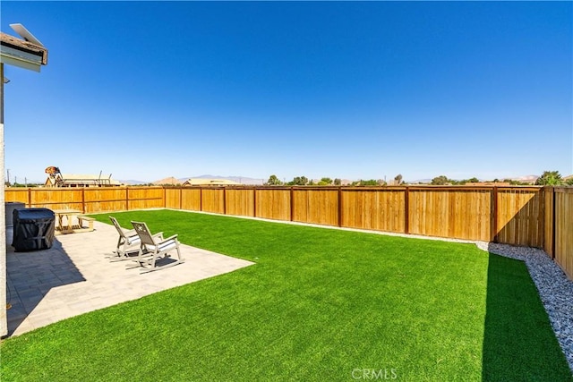 3615 Santa Monica Ct, Rosamond, CA 93560 - fenced backyard with a patio