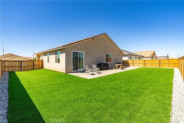 3615 Santa Monica Ct, Rosamond, CA 93560 - back of house featuring stucco siding, a fenced backyard, and a patio