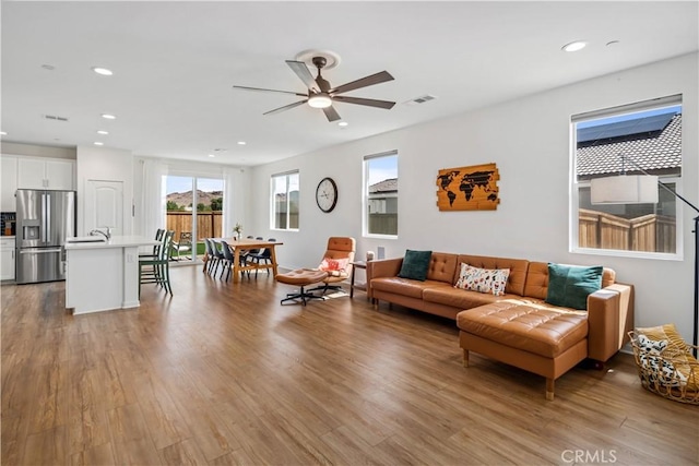 3615 Santa Monica Ct, Rosamond, CA 93560 - living room featuring wood finished floors, ceiling fan, and recessed lighting