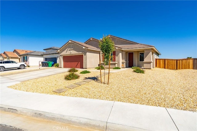 3615 Santa Monica Ct, Rosamond, CA 93560 - single story home with driveway, a garage, stucco siding, and a tiled roof