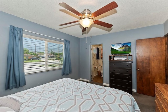 1255 E 25th St, San Bernardino, CA 92404 - bedroom featuring dark carpet, a textured ceiling, a ceiling fan, and baseboards
