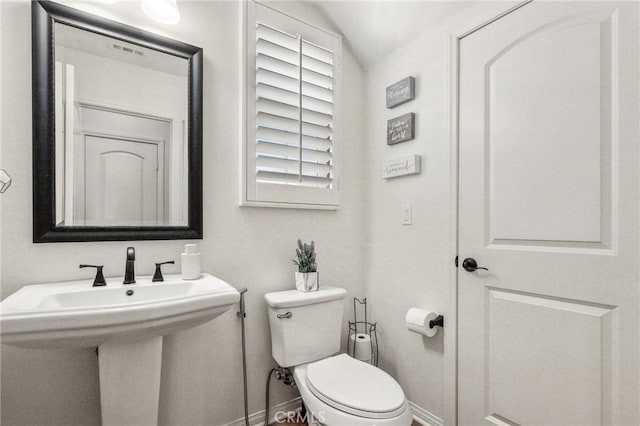 410 N Tapia Ln, Brea, CA 92821 - bathroom with baseboards, toilet, a sink, and vaulted ceiling