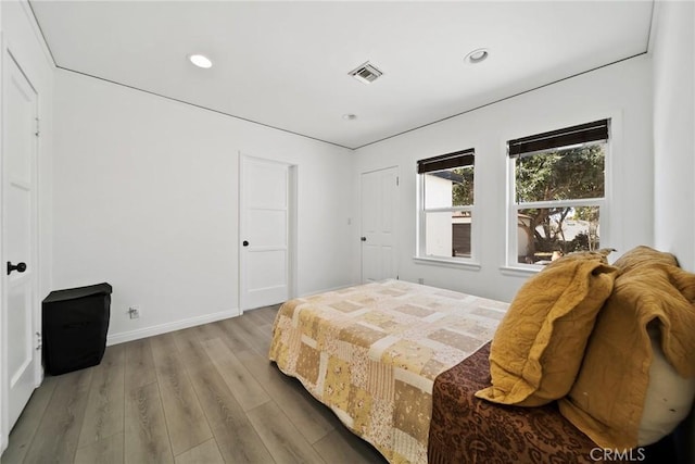 3549 S Cochran Ave, Los Angeles, CA 90016 - bedroom with wood finished floors, recessed lighting, and baseboards