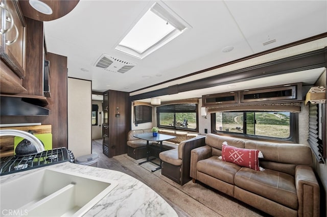 32955 Buckskin Rd, Temecula, CA 92592 - living area with wood finished floors and a skylight