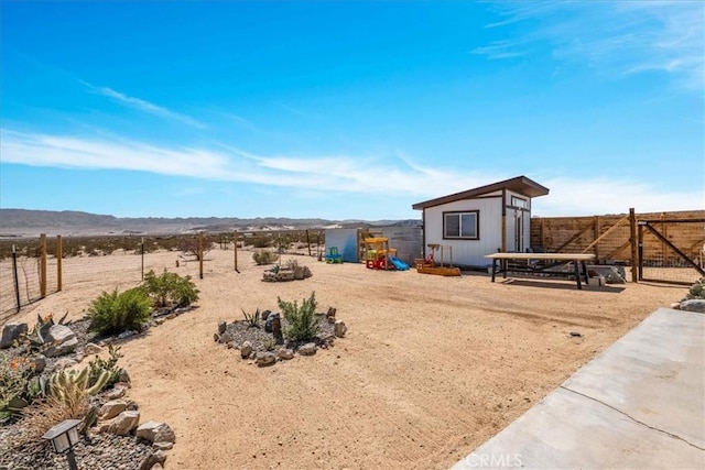 68365 Emerald Dr Unit 29, Palms, CA 92277 - fenced backyard featuring a gate and a mountain view